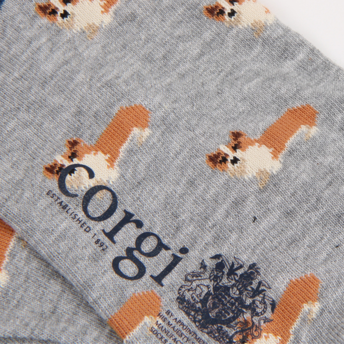 Gray sock with corgi pattern and 'corgi' text on a white background