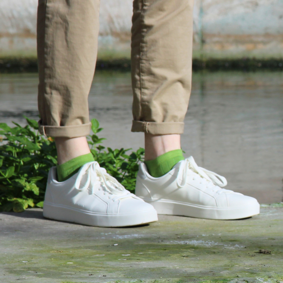 Men's cotton trainer socks available in a range of colours from traditional white socks to vibrant green.