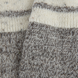close up detail of the flecked British Wool on a sock.