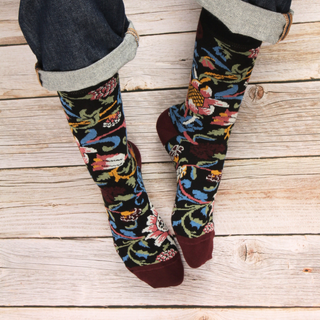 Colorful patterned socks on a wooden floor