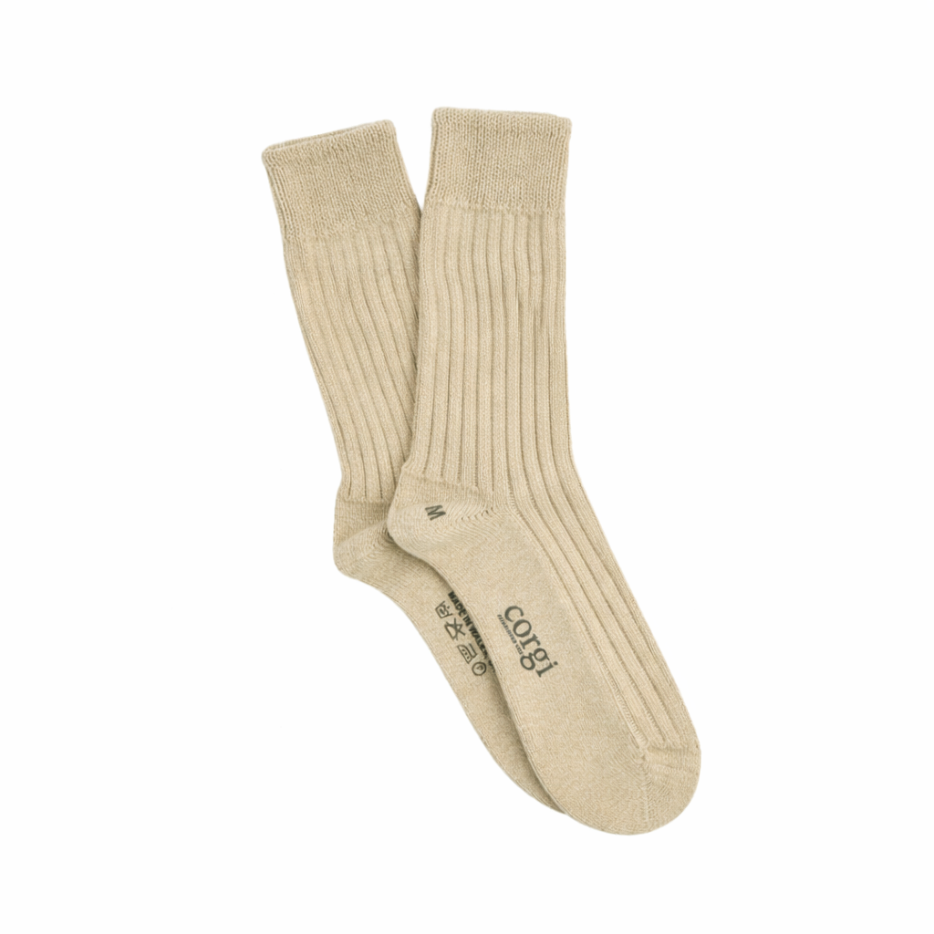 Beige sock on a white background