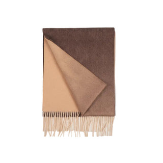A woven cashmere scarf in ombre color with a geometric triangle shape on a white background, featuring a fringe at the bottom.