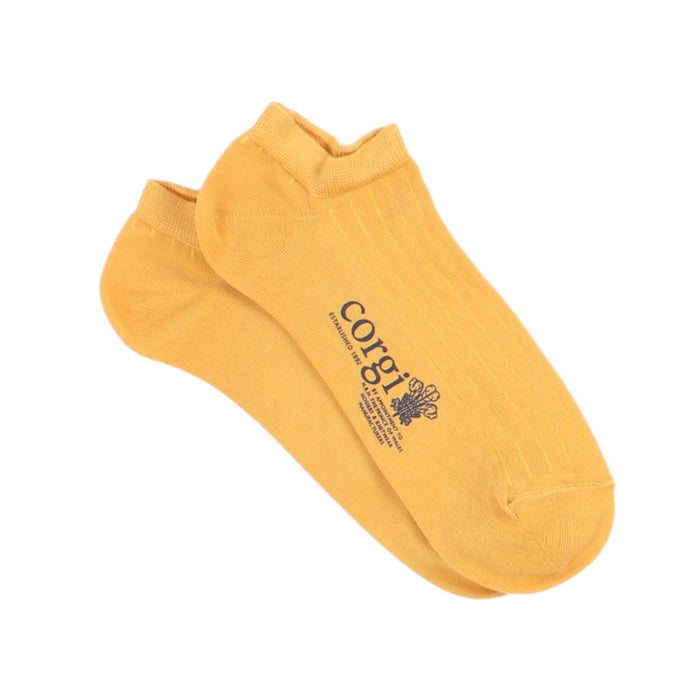 A collection of women's trainer socks in various colors, including black, pink, green, yellow, grey, and blue, all with the 'Corgi' brand logo on the side.