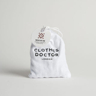 White drawstring bag with 'Clothes Doctor London' branding on a light gray background