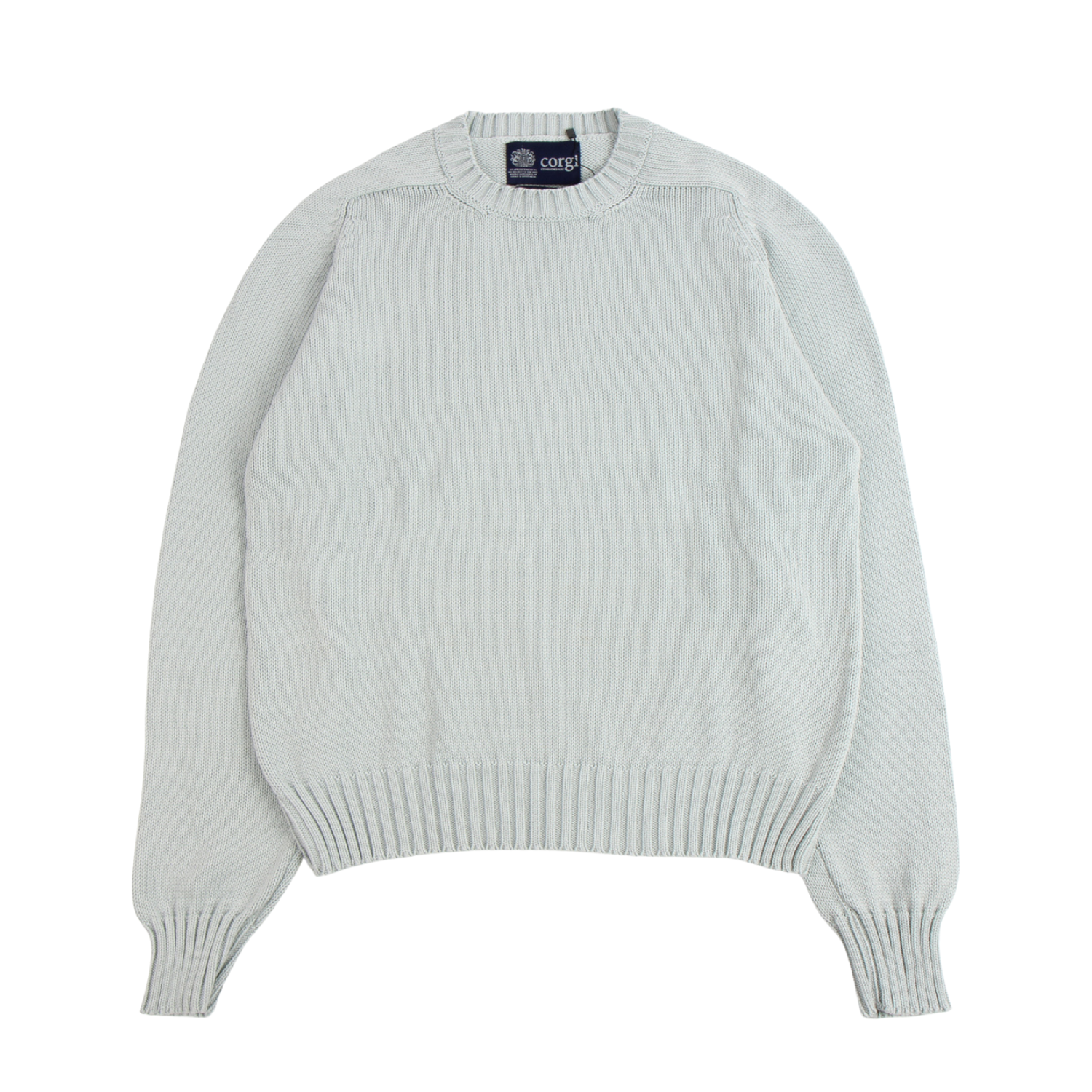 Light green sweater with a brand label on a white background
