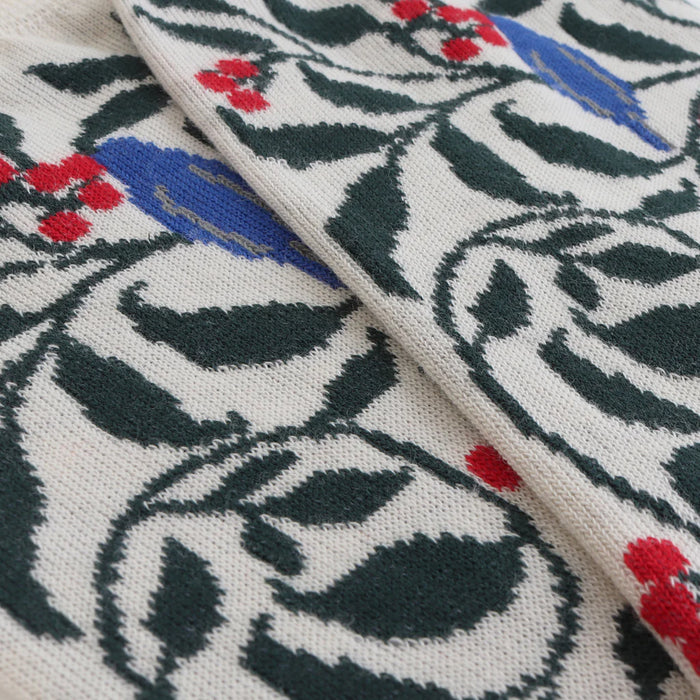 Close-up of a fabric with floral and leaf pattern