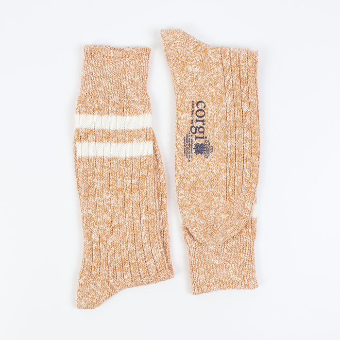 Pair of gold marl socks with a visible brand logo on a white background