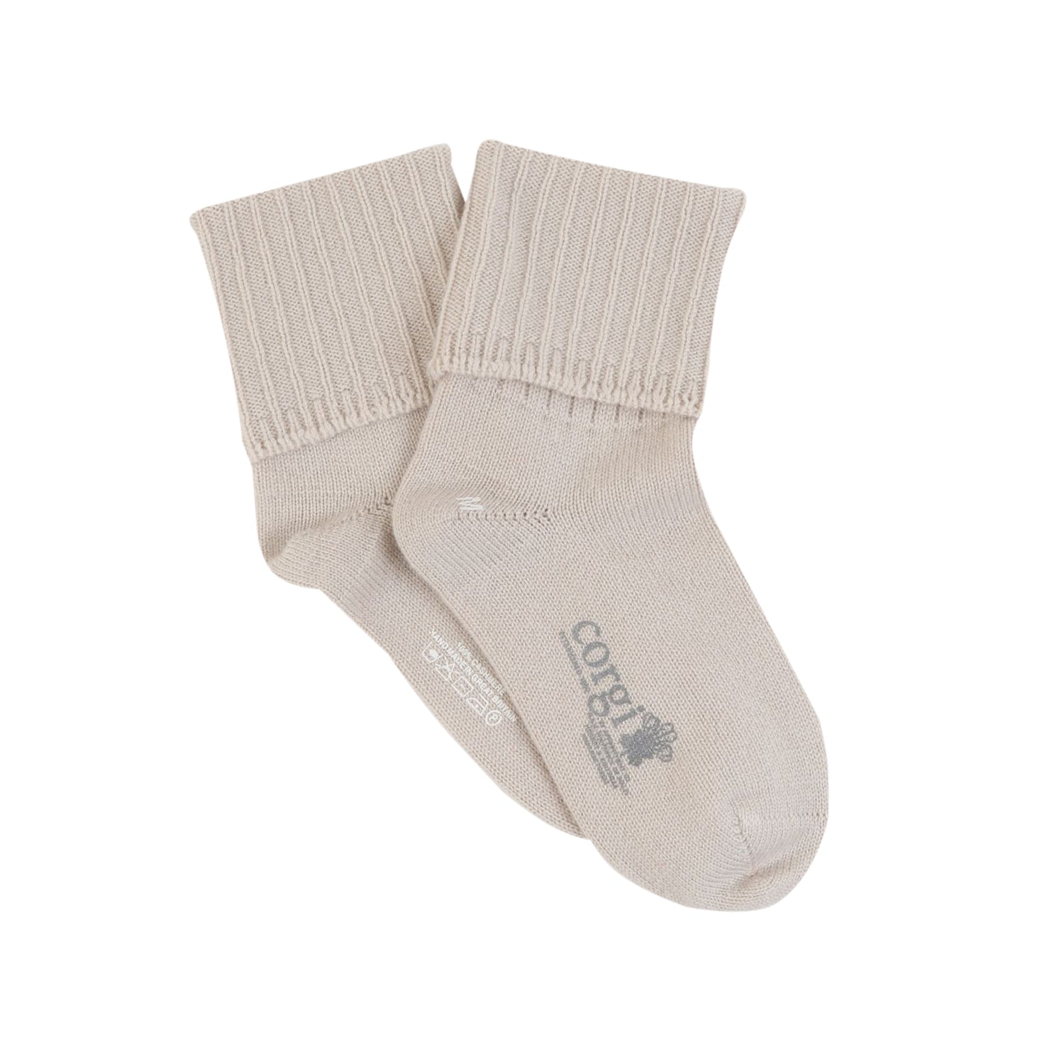 A pair of beige pure cashmere bed socks with a roll-over top, ribbed leg, and flat foot construction.