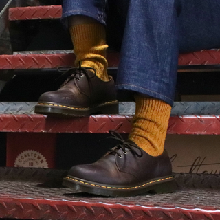 girl wearing gold Donegal wool socks