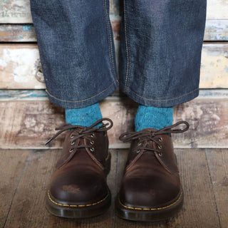 woman wearing teal colour Donegal wool socks 