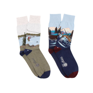 Two pairs of socks with nature and fishing themed designs photographed on a white background, 