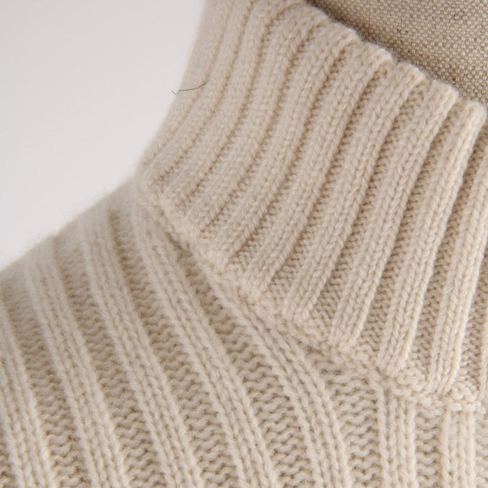 Close-up of a white rib knitted sweater showing the collar detail