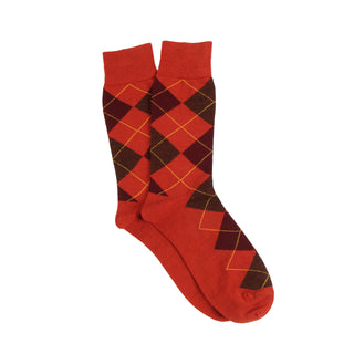 Orange argyle patterned socks on a white background