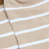 Close-up of beige fabric with white stripes