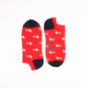 Red socks with dog pattern on a white background