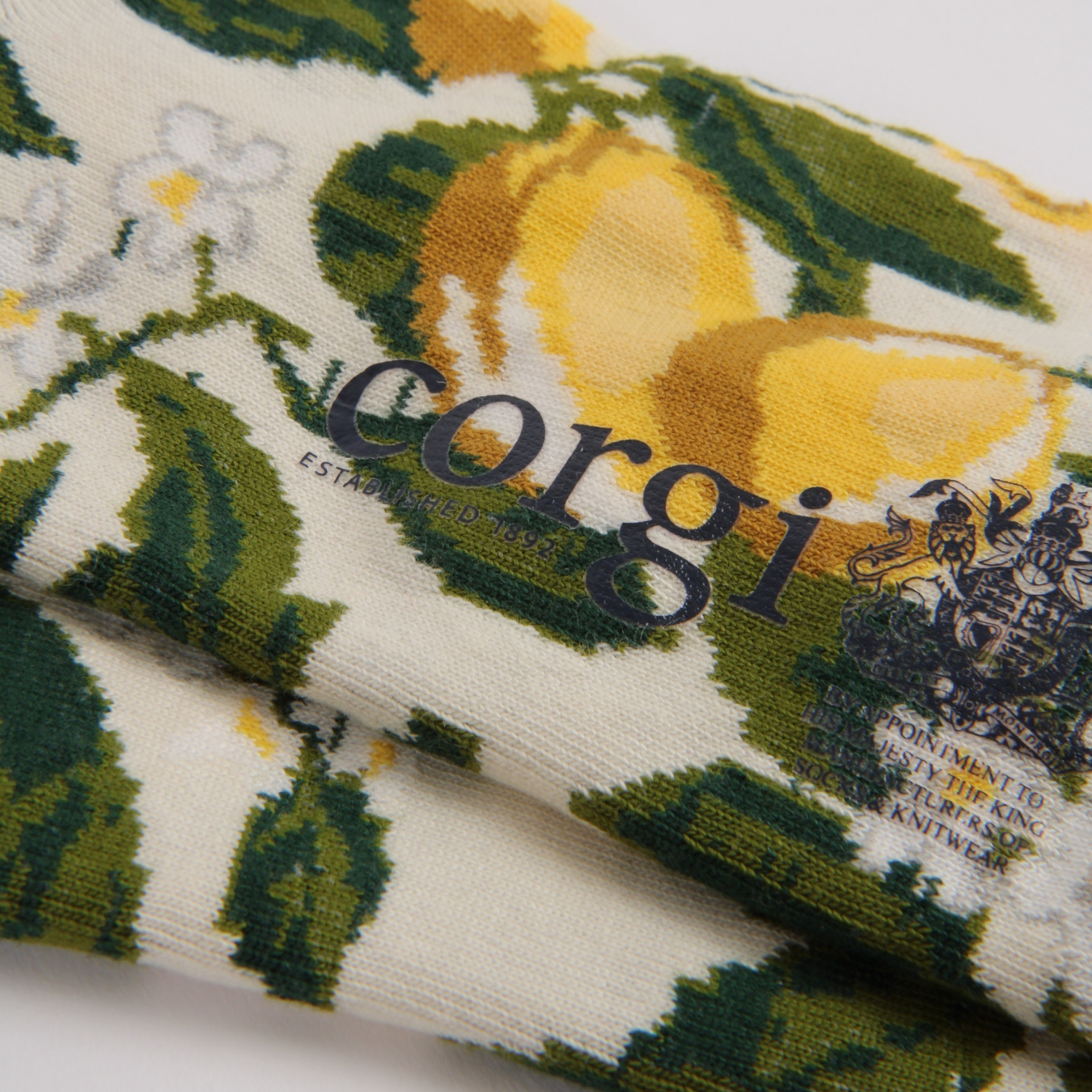 Corgi brand fabric with lemons and flowers on a white background