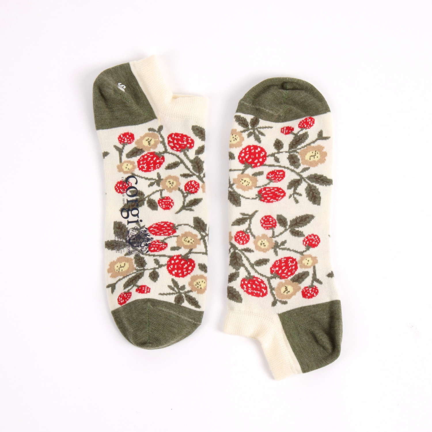 Pair of trainer length socks with red floral patterns and strawberrys on a beige background