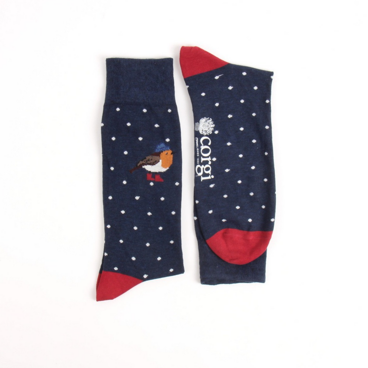 A pair of navy blue socks with white polka dots, featuring a robin bird graphic on one sock and a white corgi logo on the other, with red heels, toes, and cuffs.