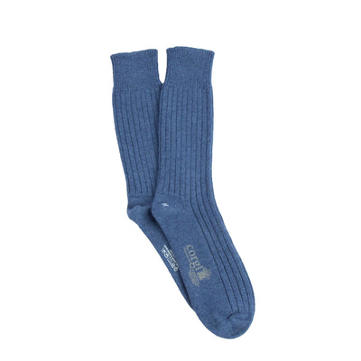 Pair of blue cashmere ribbed socks on a white background