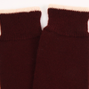 Close-up of maroon knit socks with a white background
