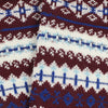Close-up of patterned fabric with blue, white, and burgundy colours.