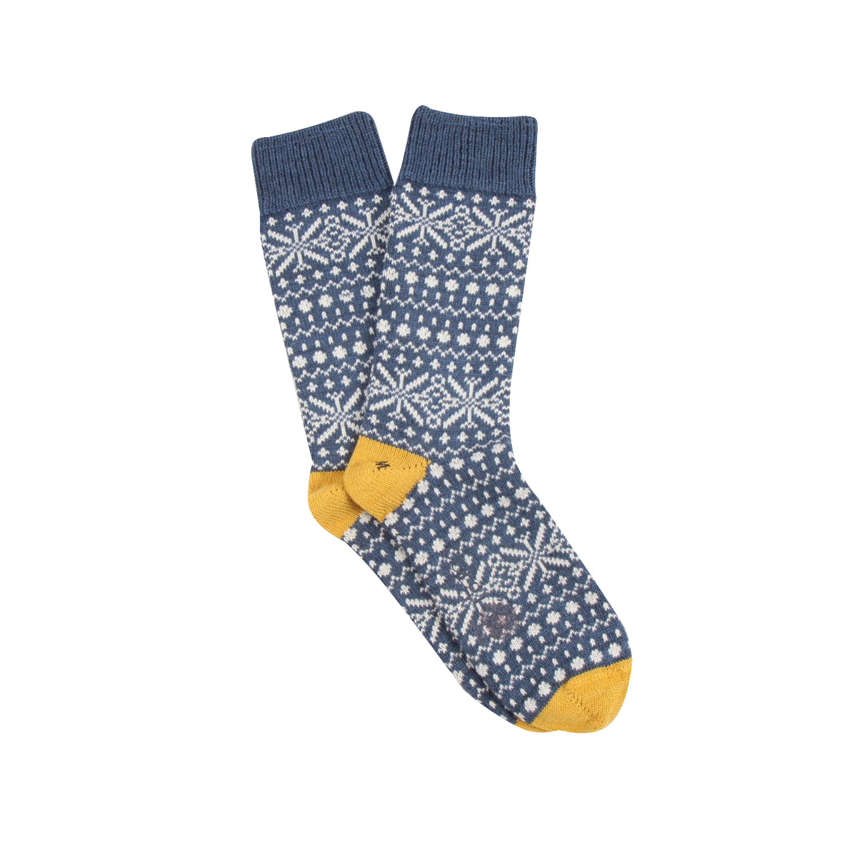 A pair of navy blue knit socks with a white Nordic snowflake pattern and mustard yellow toes, shown on a plain white background.