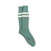 Green sock with white stripes on a white background