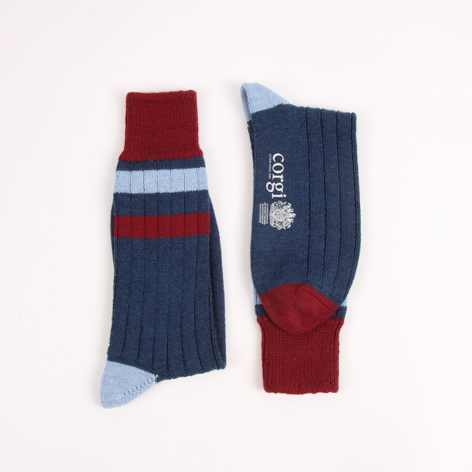Socks with red, blue, and white stripes on a white background