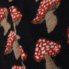 Close-up of fabric with red and white patterned shapes on a Navy background