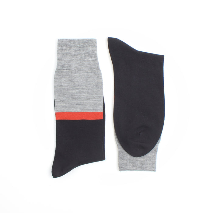 Close-up of a fabric with gray,orange and navy stripes.