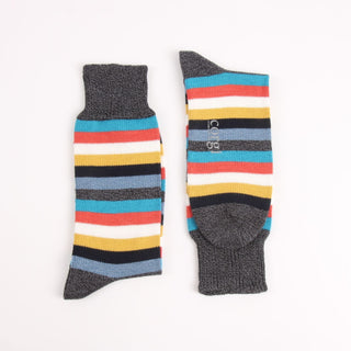 Pair of striped socks with gray cuffs photographed on a white background