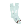 Light aqua socks with skull and crossbones design on a white background