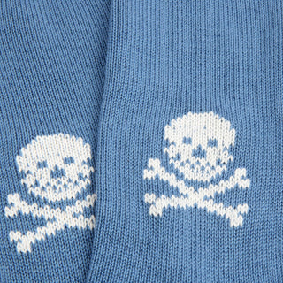 Blue fabric with white knitted skull and crossbones pattern