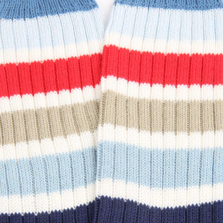 Close-up of striped fabric with red, white, blue, and beige colors.