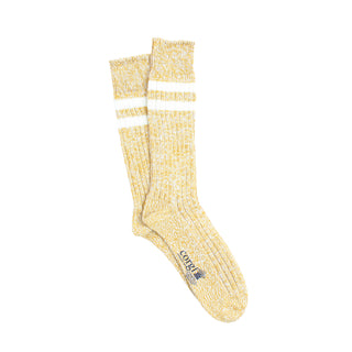 Yellow sock with white stripes on a white background