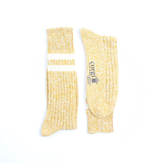 Yellow socks with a brand logo on a white background