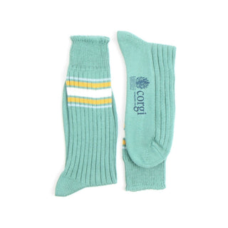 Pair of green socks with white and yellow stripes on a white background