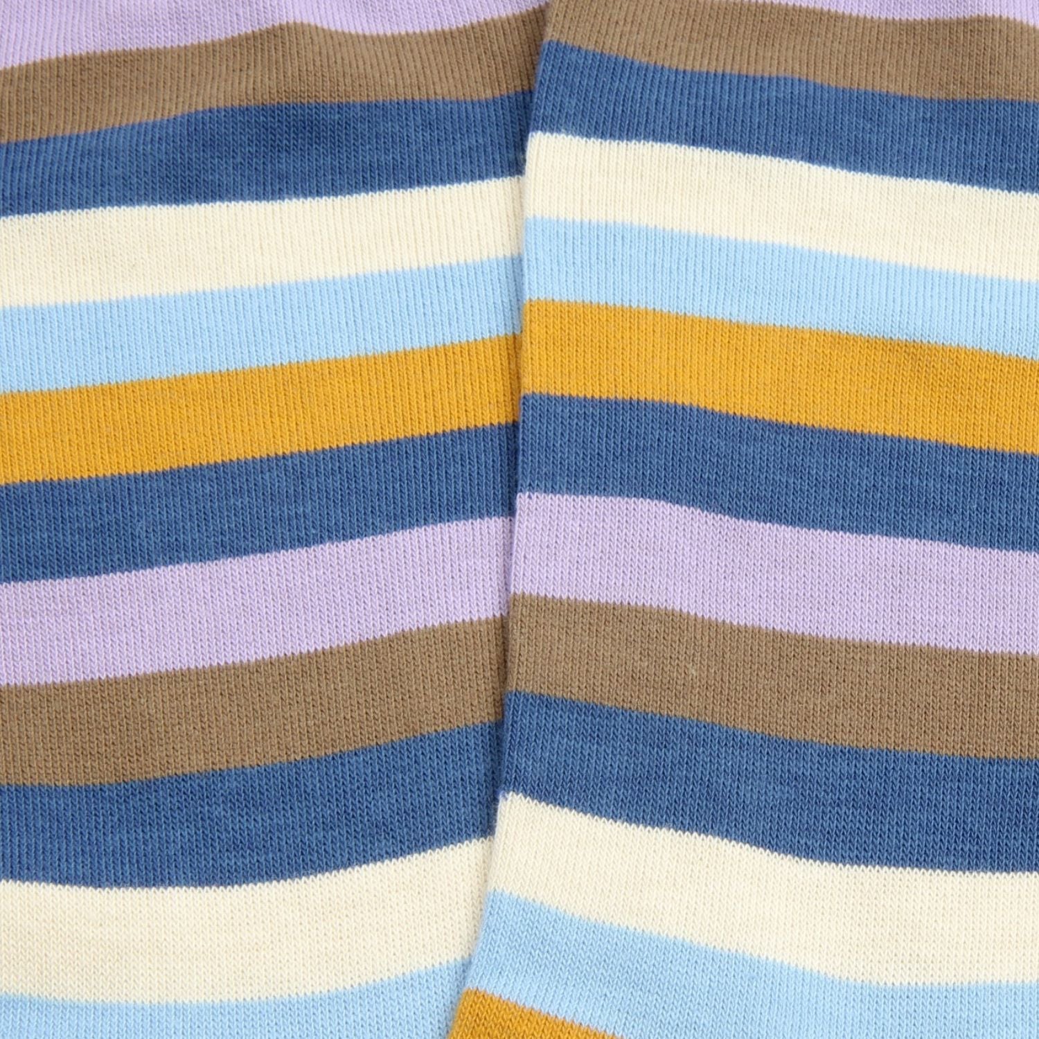 Close-up of striped socks with blue, brown, yellow, and white colors.