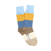 Color-blocked sock with blue, yellow, and brown sections on a white background