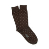Brown socks with white polka dots on a white background