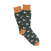 Green socks with gold accents and corgi pattern on a white background