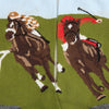 close up of  a horse racing scene with green and blue background, brown horse and two different jockey shirt colours, checked and red.