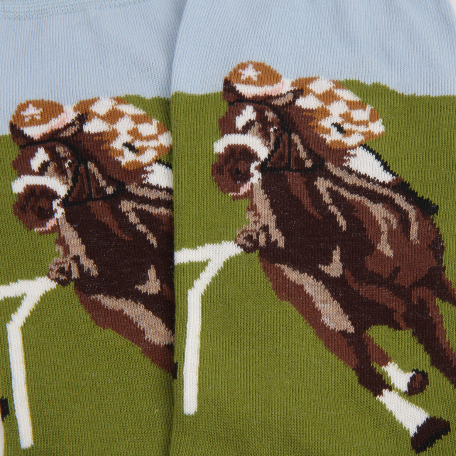 Horse racing socks with a green background