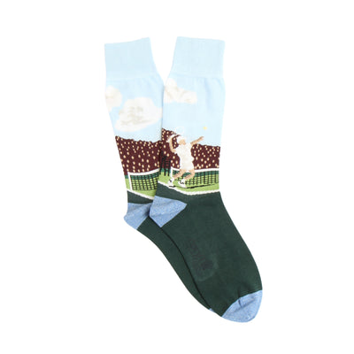 A pair of men's tennis socks with a pattern depicting a tennis player and crowd scene on a light background, with dark green at the cuffs.