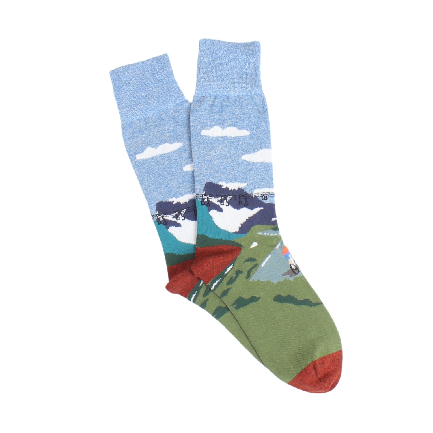 Colourful socks with a cyclist on a mountain photographed on a white background