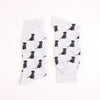 Two grey socks with black labrador retriever pattern on a white background