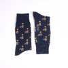 Navy blue socks with dog pattern on a white background