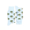 Light blue socks with palm tree pattern on a white background