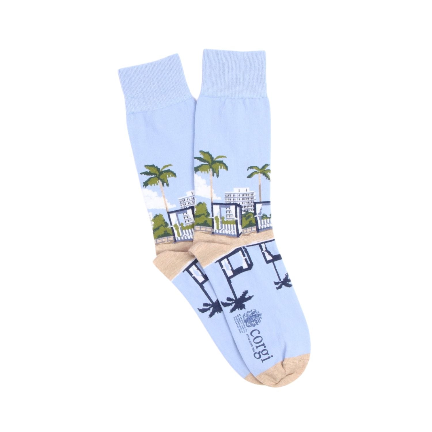 Light blue sock with palm tree and building design on a white background