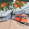 Socks with a cable car and orange trees design on a scenic background